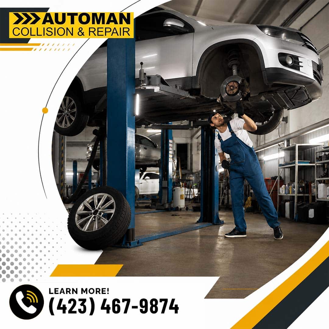 Can a Scan Replace an ADAS Calibration in Collision Repair? 2 An auto technician inspecting the brakes and undercarriage of a silver SUV raised on a two-post hydraulic shop lift.